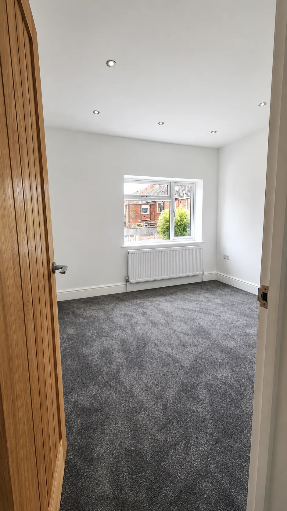 Third bedroom — added as part of the 2-to-3 bed conversion. Fresh décor, new carpet and oak doors throughout.