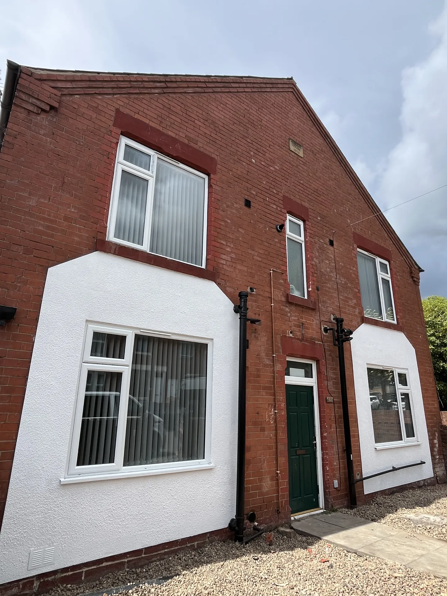 Exterior — red-brick semi in Mexborough, freshly rendered and repainted ahead of handover.